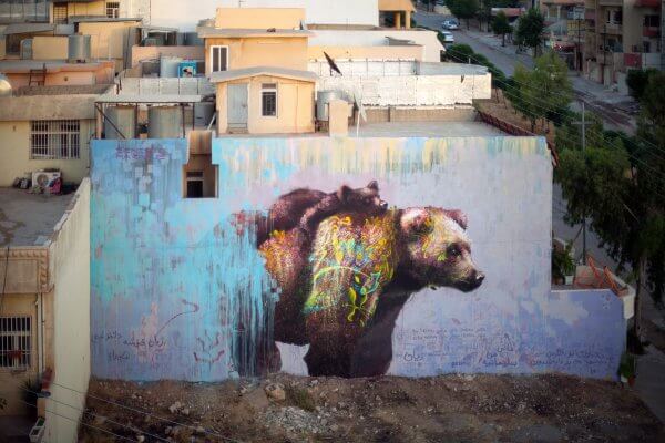 Ernesto Maranje, Bear with cub street art mural, Iraq 2017. Photo credit aptART