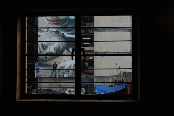 Guido Van Helten, Mahim (E) Art District, St+art Urban Art Festival, Mumbai 2017. Photo Credit Akash Shukla