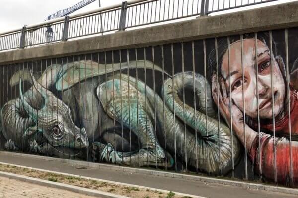 Herakut, Street art Mural "Your Stories make me forget those Prison Bars", Aalborg, Denmark 2018. Photo Credit Lene Kirk