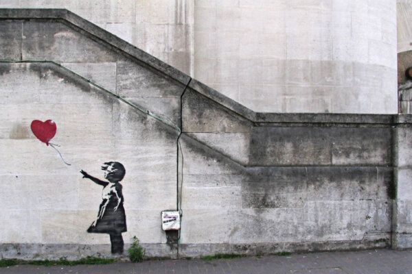 The meaning behind Banksy's 'Girl with Balloon' - Explained. Image © Banksy
