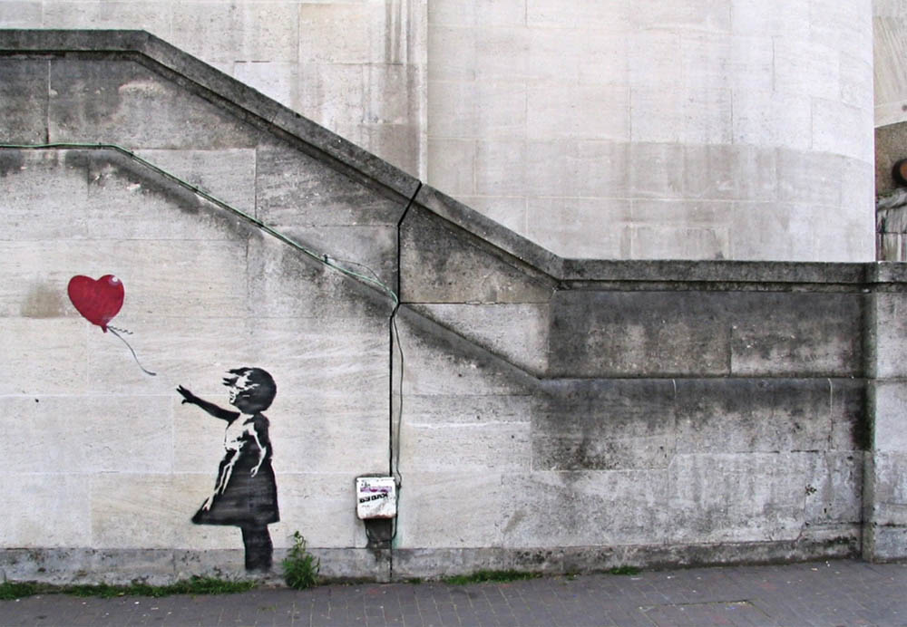 The meaning behind Banksy's 'Girl with Balloon' - Explained. Image © Banksy
