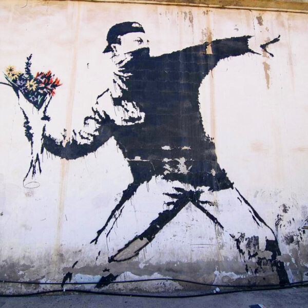 Banksy – Love is in the Air (Flower Thrower)  Image @ GraffitiStreet.com